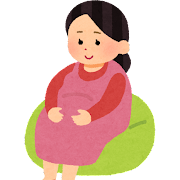 クッションに座っている妊娠後期の妊婦さんのイラスト